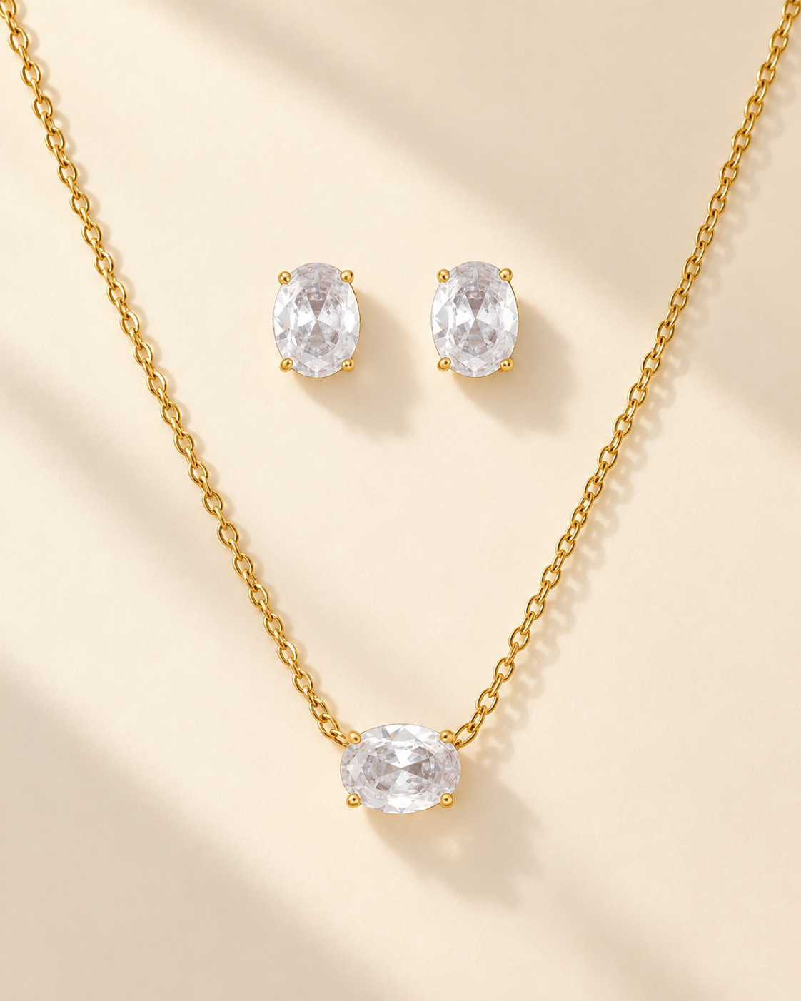 Conjunto Oval, colar e brincos dourados com zircónia oval — Solène Lisboa