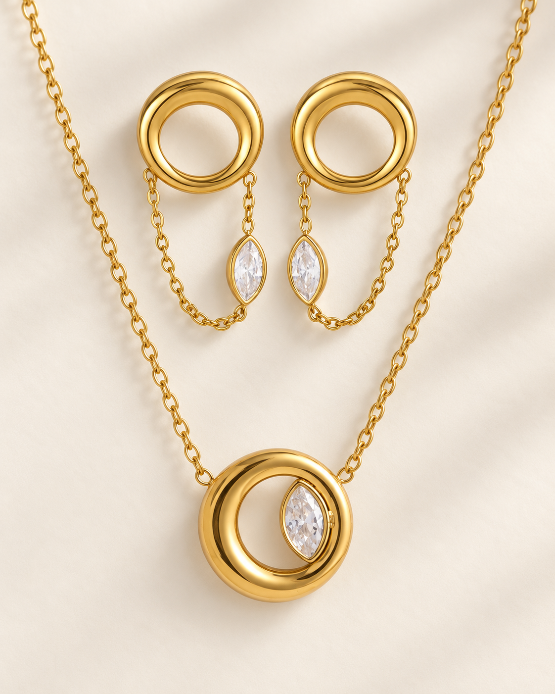 Conjunto Eclipse, colar e brincos dourados com círculo e zircónia marquise — Solène Lisboa
